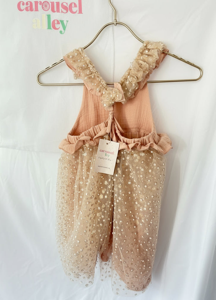 The starry Noel Christmas dress Premium blush muslin with layered pearl-sparkle tulle

Ruffled straps and adjustable tie-back for perfect fit - carousel alley-back 
