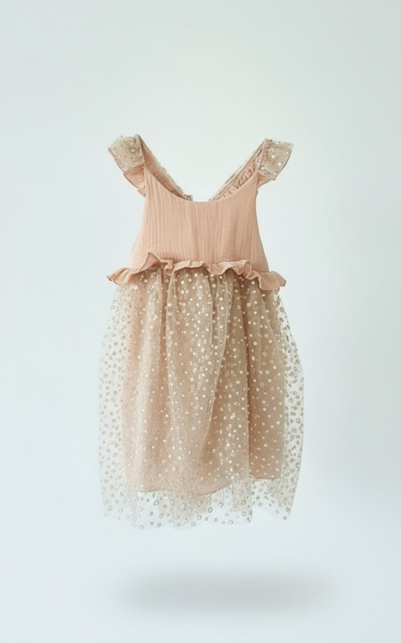 The starry Noel Christmas dress Premium blush muslin with layered pearl-sparkle tulle

Ruffled straps and adjustable tie-back for perfect fit - carousel alley-front 
